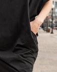 close up of a black shift dress with pockets