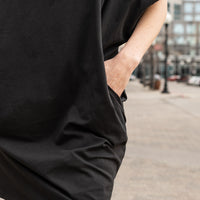 close up of a black shift dress with pockets