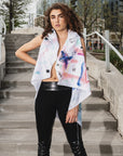 A woman wearing an asymmetrical linen hand painted vest open by Malaika New York x Tato