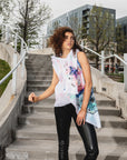 A woman wearing an asymmetrical colourful hand painted linen vest Malaika New York x Tato