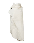 A white faux fur asymmetrical vest with black snaps by Malaika New York