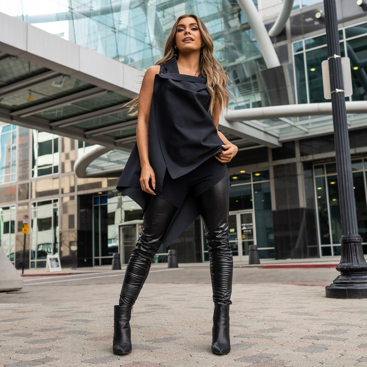 a woman wearing black faux leather leggings by Malaika New York