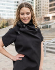 Close up details of A woman wearing a knee length black shift dress by Malaika New York