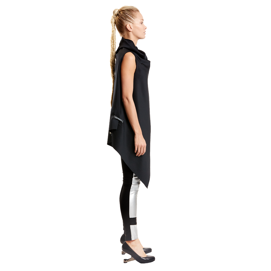 A blonde woman wearing an asymmetrical sustainable vest by Malaika  New York