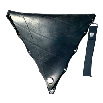 Image of a triangle bag made from up-cycled truck tire. You can see the tire marks. Finished with silver trim and an organic cotton handle by Malaika New York